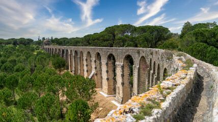 Fototapeta na wymiar Tomar, Portugal - April 2018: Pegoes aqueduct by the Castle and Convent of the Order of Christ