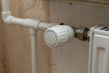 Russia. Saint-Petersburg. Major repairs of heat supply systems of a residential building. Radiator with regulator.