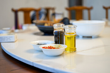 Seasoning combination on the hotel table, soy sauce, edible oil, chili perilla