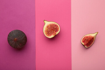 Fresh ripe figs on colorful pink background. Tropical fruit