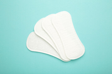 Sanitary pads on blue background. Women period