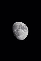 deep dark sky with moon showing light and shadow