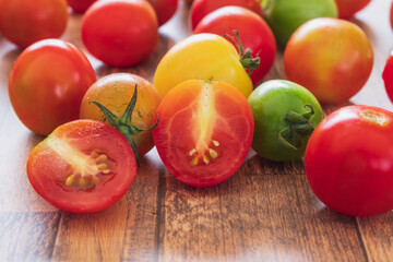 fresh tomatoes on wooden background