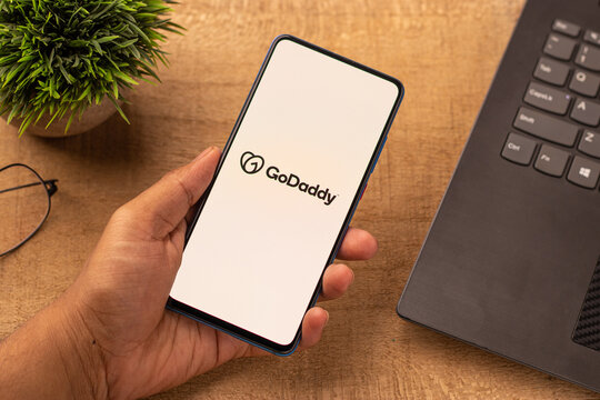 Assam, india - April 10, 2021 : GoDaddy logo on phone screen stock image.