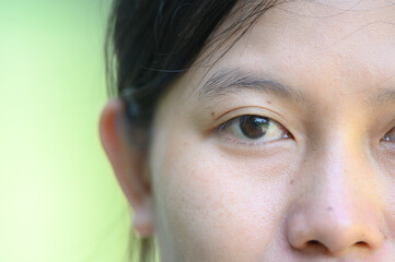 Naklejka premium Closeup of beautiful Asian woman’s eyes.asian woman face without makeup