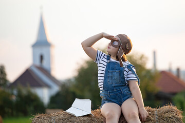 Happy child playing aviatos outdoors. Travel and adventure concept