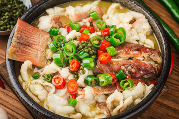 Chinese food:boiled fish with pickled cabbage and chili. Red grouper fillets
