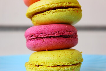 colorful macaroons on a table, yellow and purple