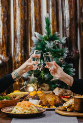 festive New Year's table with delicious dishes in the Soviet style, olives, baked meat, lard, champagne