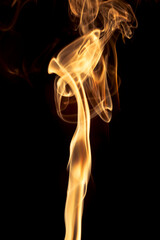 Gold smoke on black background.