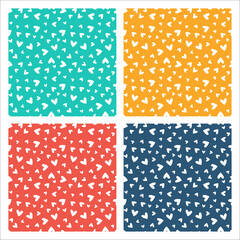Set of 4 colorful seamless patterns with white hearts