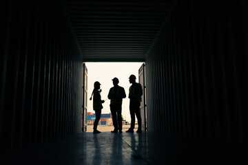 silhouette Group of staff worker standing and checking the containers box from cargo ship for...