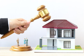 Property auction, Woman hand holding gavel wooden and model house on white background, lawyer of...