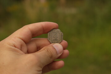 Vintage coin of India in hand