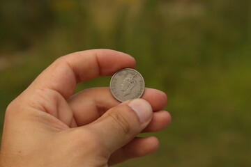 Vintage coin of India in hand