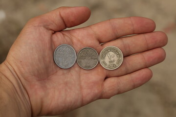 Old arab coins in hand