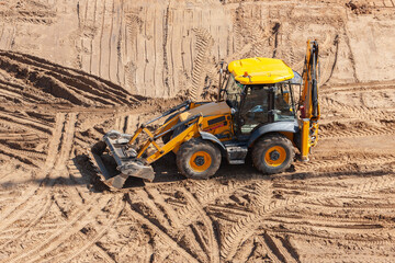 Big yellow excavator, dozer shovel on the construction site. 