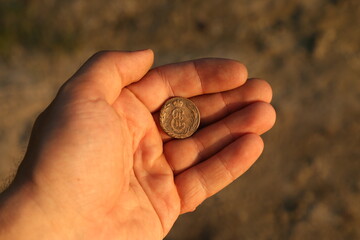 Fototapeta na wymiar Old Russian Siberian copper coin in hand