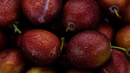 Plums. Fresh plums top view, rotation. Healthy Nutrition concept