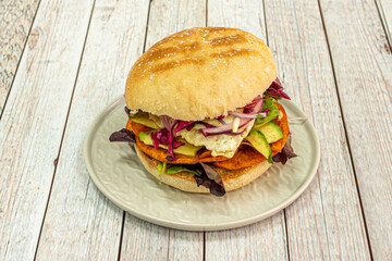 Peruvian sandwich with avocado, fried egg, ripe banana in chips, red onion and assorted lettuce shoots