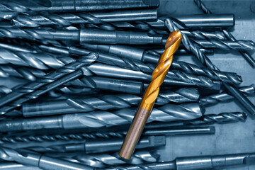 The group of various size of drill tools on the container box.