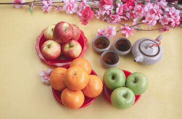Group of red and green Apple,Orange fruit put beside Chinese tea cup.