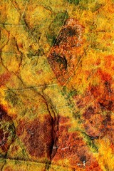 Rust and autumnal leaf double exposure showing the texture and colours of both