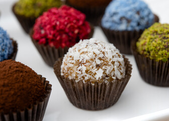 colourful vegetarian sweet balls on white background 