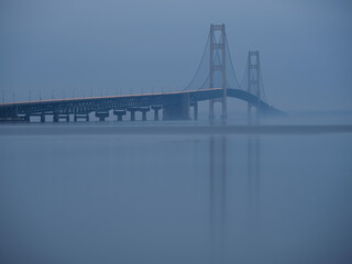 Michigans Mighty Mac the Mackinac Bridge connecting the Lower and Upper Peninsula photographed in fog during blue hour