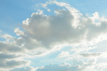 blue sky background with tiny clouds.