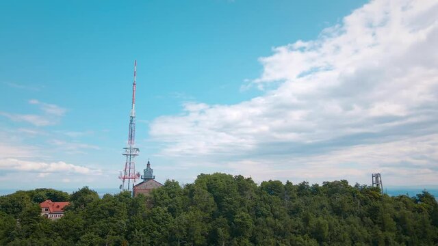 Drone flight over mountain village with forests. Sleza mountain near Wroclaw in Poland. Nature background, aerial view