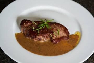 ready to eat, topside roast from the young roe deer in wine mustard sauce