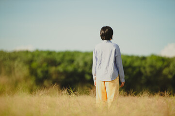 Young woman beautiful woman happy at the beautiful meadow at sky background. happiness concept.