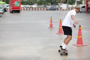 young man skater riding on skateboard