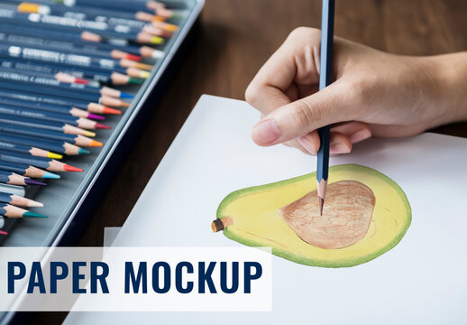 Woman Drawing on Blank Paper Mockup with Set of Colored Pencils