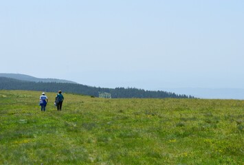Fototapeta premium people on a hiking trail in the mountains