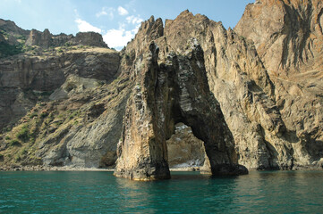 Famous Golden Gate rock in Karadag rock in the form of an arch in the sea. Rocks and the sea. National park near Koktebel Crimea