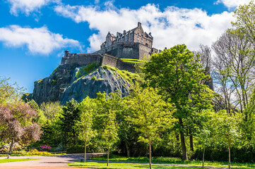 Fototapeta na wymiar A view from Princes Street Gardens towards the Castle in Edinburgh, Scotland on a summers day
