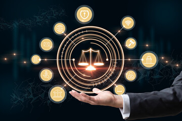 Businessman holding the icon of the balance of justice. Concept of legal advice, law and defense and of providing legal services and defense in court.