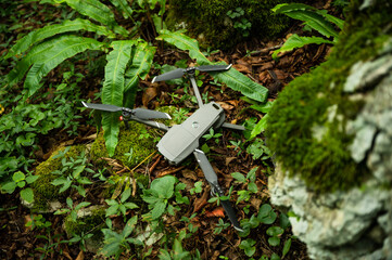 Crashed Drone on the ground in a forest