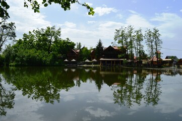 Obraz premium landscape of a park and a summer house on the lake