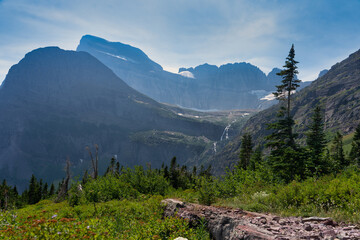 Fototapeta na wymiar lake and waterfall in the mountains, Glacier national park