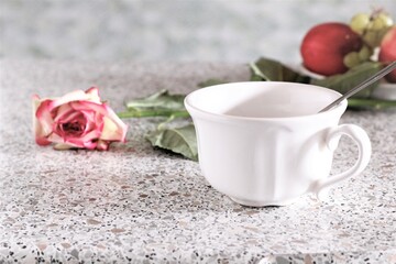 Obraz na płótnie Canvas Closeup cup of coffee with rose