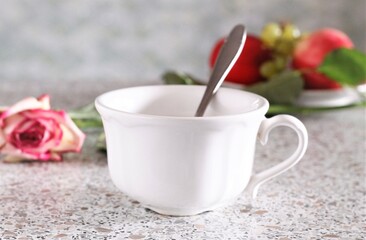 Closeup white cup of coffee and pink rose romantic love flowers cute