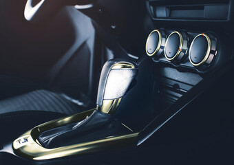 The luxury gear lever with chrome gold color of automatic transmission in the luxury automobile