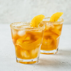 Ginger orange iced tea,refreshing  summer drink in glasses. Space for text.