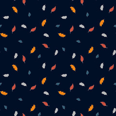 Vector seamless autumn pattern of cute tiny orange, red, blue, and grey leaves stylized in a flat and doodle style in the dark background. Hand-drawn leaf texture. Background for textile wallpapers