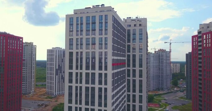Drone view of New modern high-rise residential complex in a residential area. colorful red and white houses. Aerial drone view