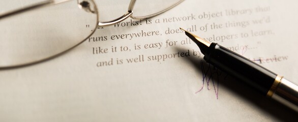 Glasses And Fountain Pen On Short Review Close-up