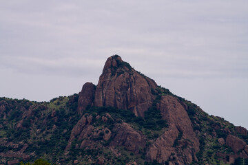 Fototapeta na wymiar South indian mountain surrounded by the agriculture land close up view. close up view of the mountain rocks..